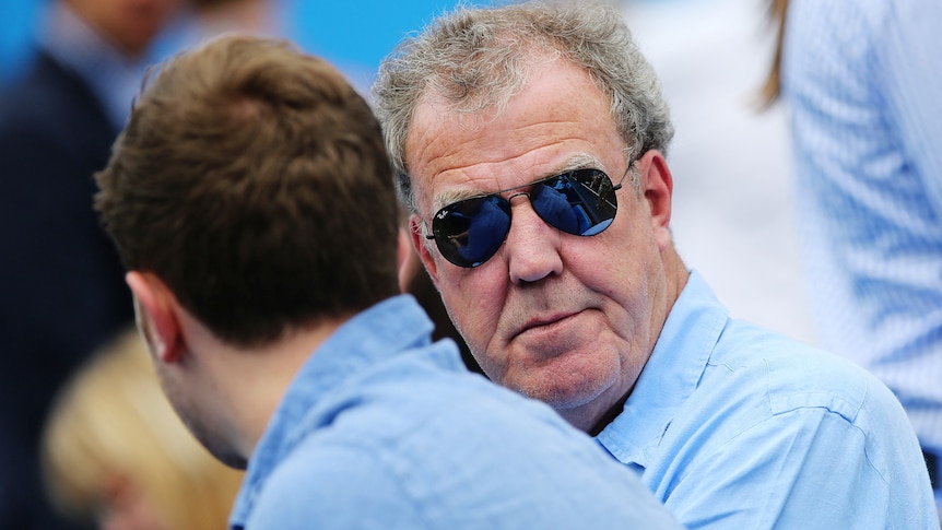 Jeremy Clarkson wearing a blue shirt and sunglasses. 