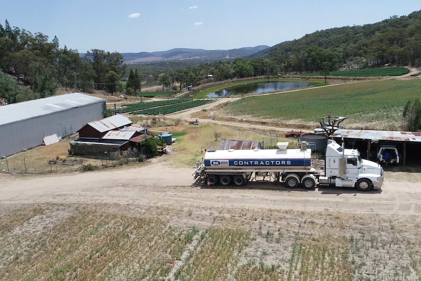 A water truck carts water around a farm near Stanthorpe.