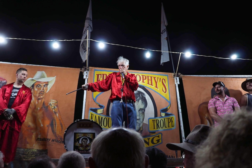 A man emceeing a fight.