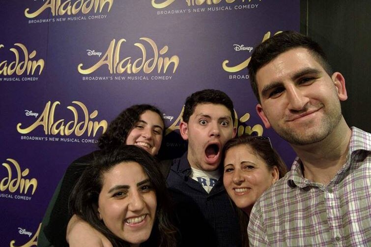 Five people smiling in a selfie photo.
