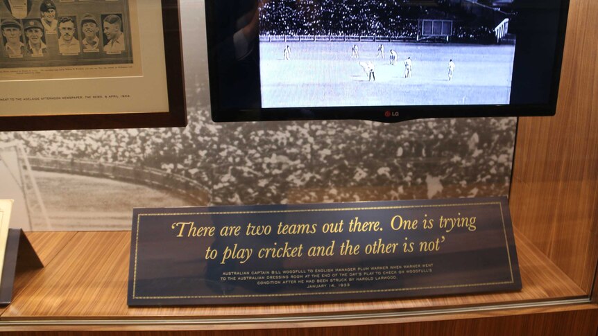 A placard featuring a Bill Woodfull quote: "There are two teams out there. One is trying to play cricket and the other is not."