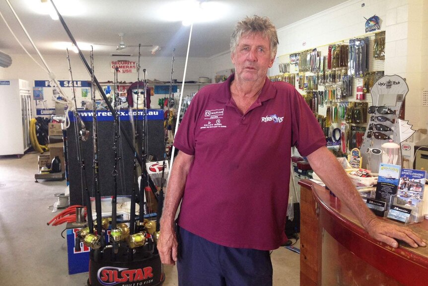 Shop owner Mick Edwards inside his boating and fishing shop, which suffers from a lack of customers