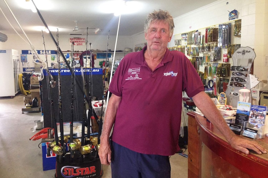 Shop owner Mick Edwards inside his boating and fishing shop, which suffers from a lack of customers