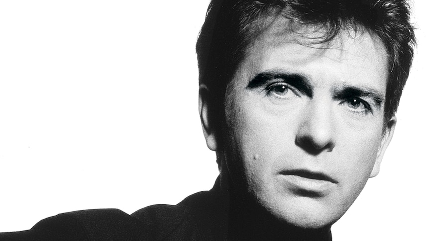 Black and white photo of Peter Gabriel against a white background
