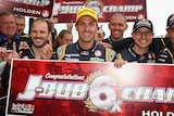 Jamie Whincup celebrates securing his sixth V8 Supercars title