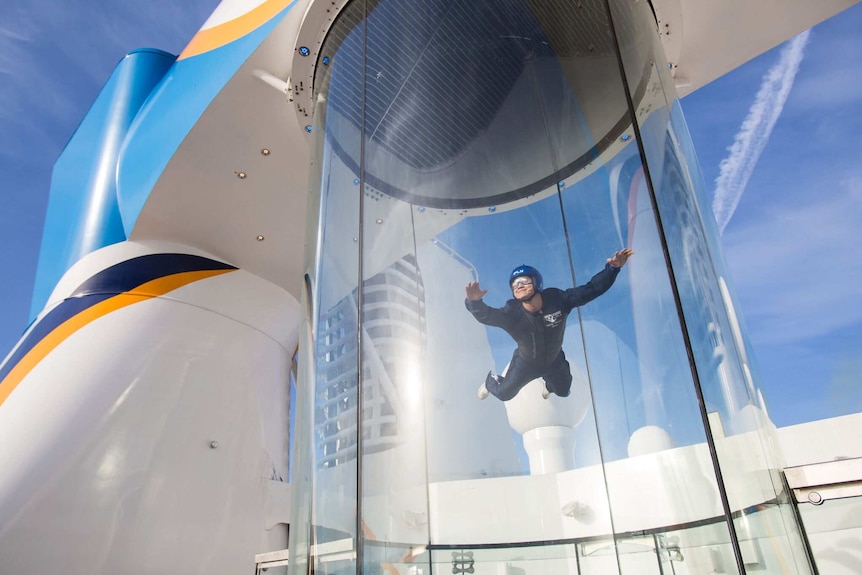 A man in a sky-diving simulation.
