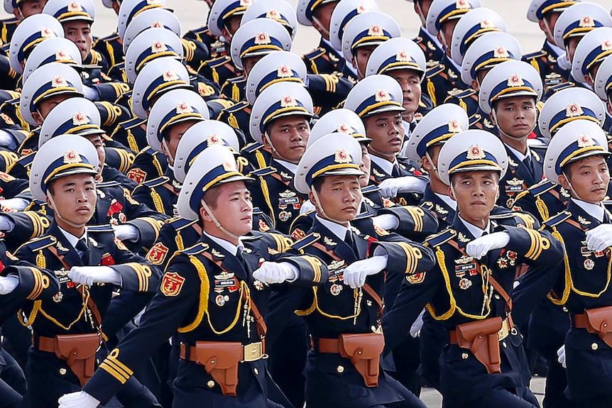 Military representatives march at the independence celebrations.