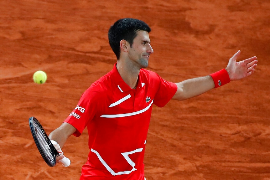 Serbia's Novak Djokovic reacts after missing a shot against Spain's Rafael Nadal in the final match.