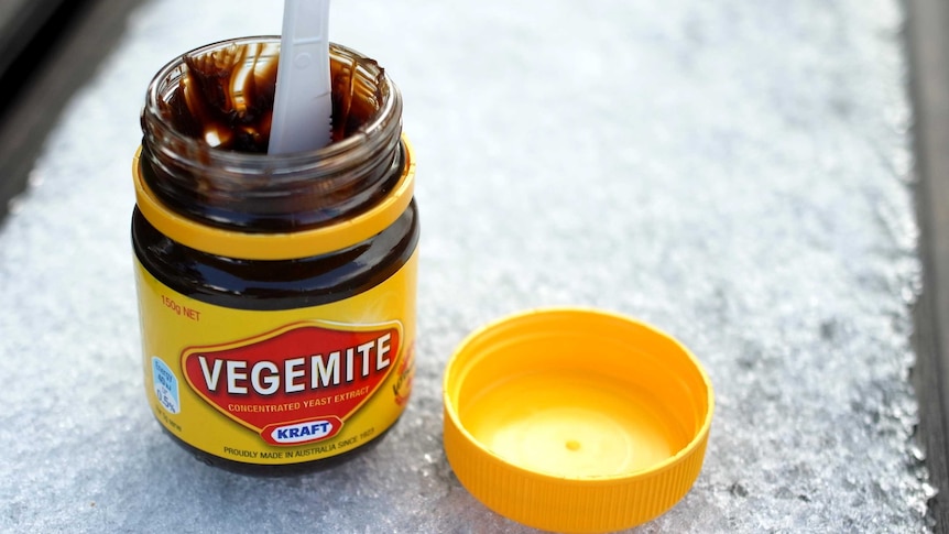 Open jar of Vegemite on ice.