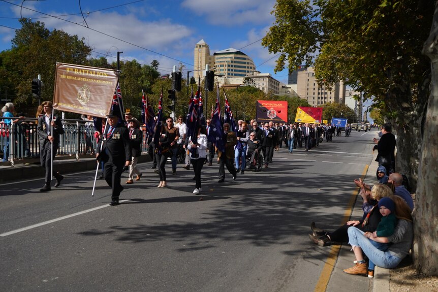 Anzac Day veterans march along Adelaide's King William Road.
