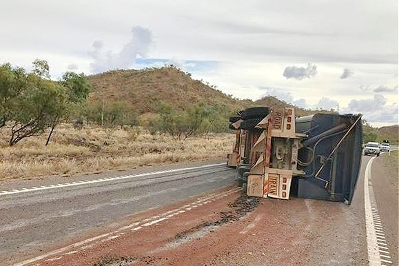 A truck overturned on an outback highway.