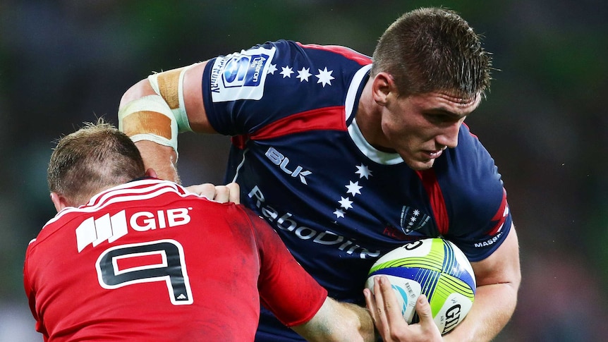 Rebels' Sean McMahon (R) takes on the Crusaders defence at AAMI Park in March 2014.