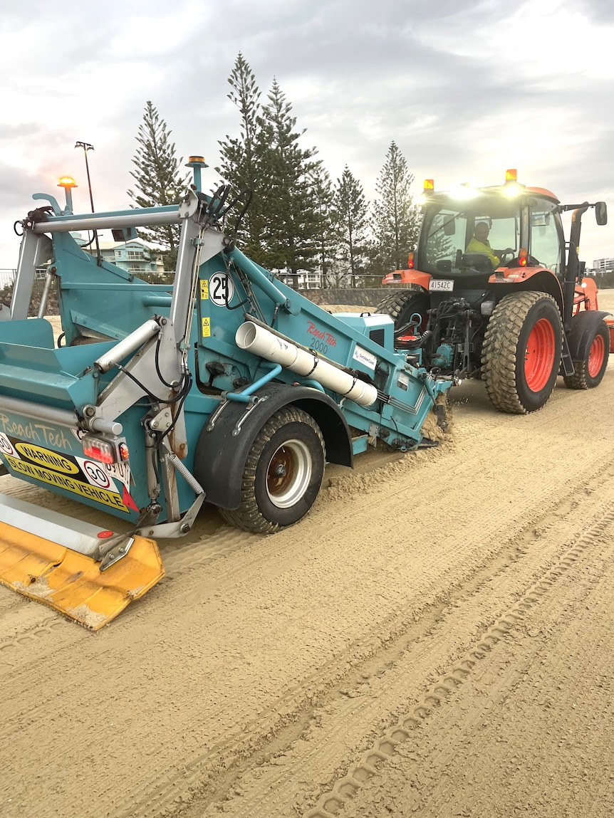Beach tractor cleans plastic beads