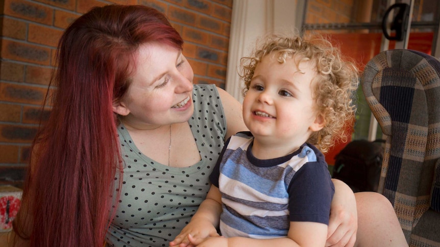 Jo Wright embraces her 2-year-old son Philip at their home in Western Sydney.