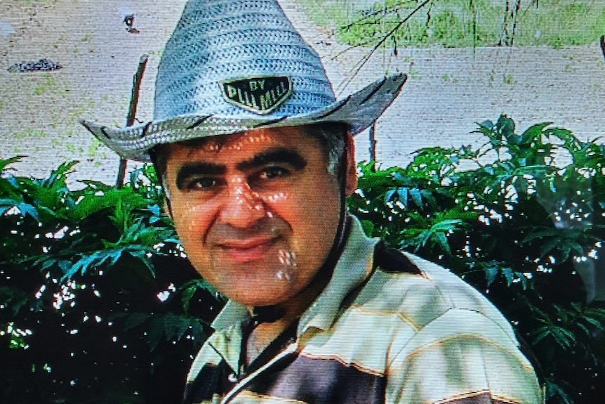 Arsalan Sadeghi Iveli is seen wearing a cowboy hat and smiling at the camera.