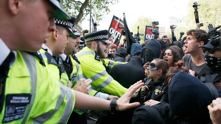 Protesters and police face off at the gates of Downing Street