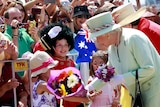 The Queen gets a royal welcome from well-wishers in Brisbane.