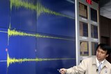 Condemned: A South Korean official shows reporters the seismic waves from yesterday's bomb test.
