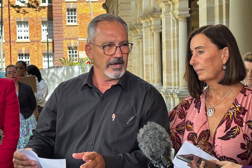 Lloyd and Sue Clarke speaking outside parliament. 
