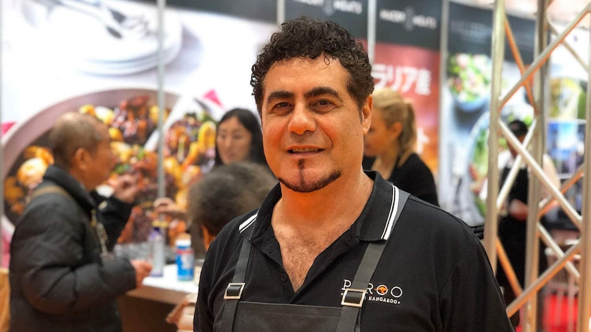 Ray Borda, National President of Kangaroo Industry Association of Australia wears a cooking apron at Tokyo Game Fair