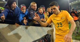 Tom Rogic greets the fans after Socceroos' win over Saudi Arabia