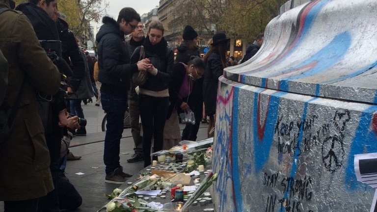 Tributes are left at Place de la Republique in Paris.