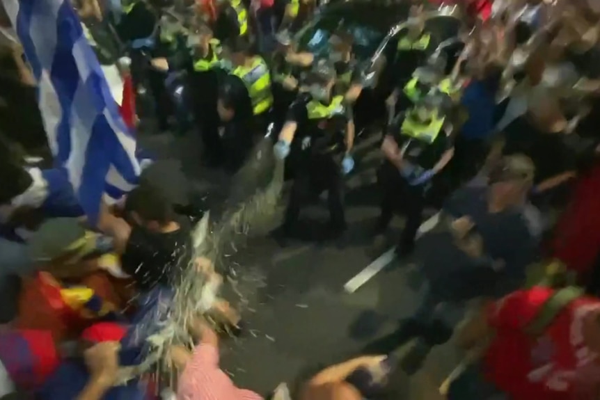 Police spray a crowd