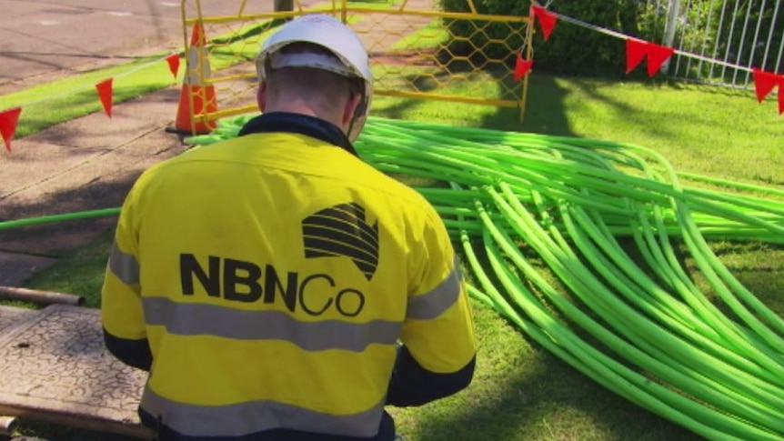 A NBN Co worker at work with cables.