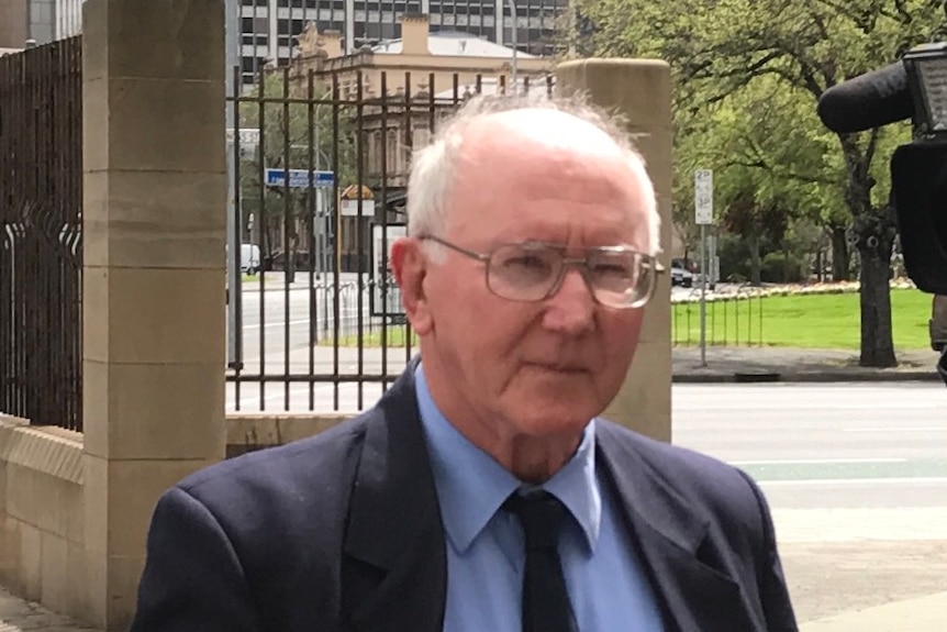 Father Bill Brady outside court