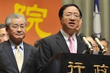 Taiwan's premier Jiang Yi-huah speaks next to vice premier Mao Chi-kuo during a press conference