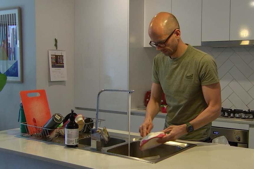 A man washing up.