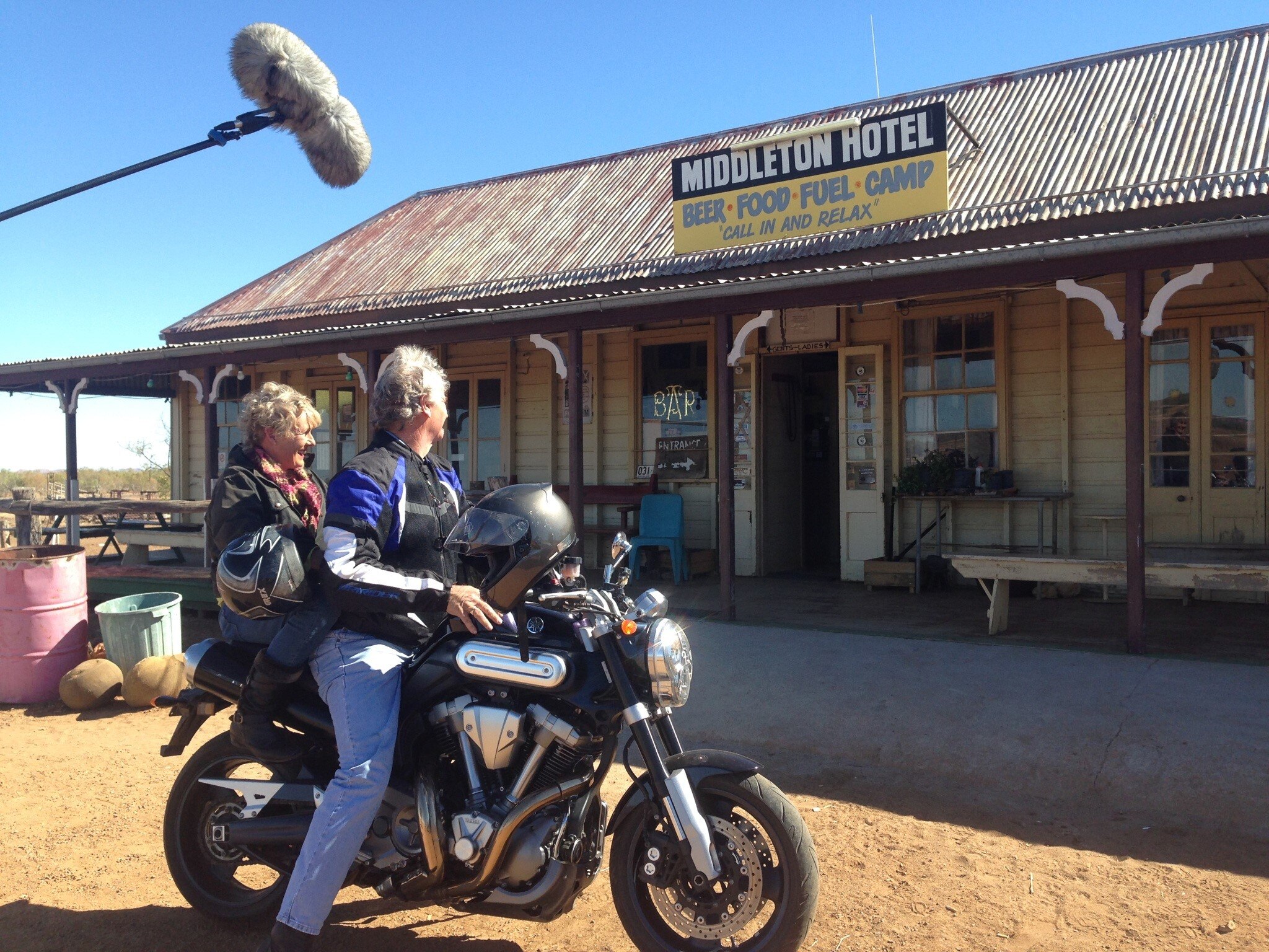 Heather Ewart on motorbike with Butch Lenton at Middleton hotel, QLD
