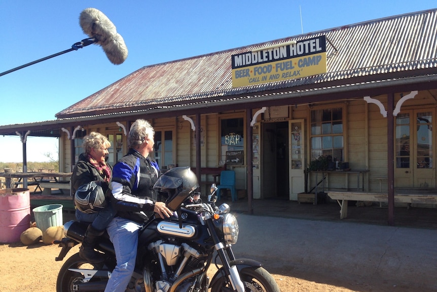 Heather Ewart on motorbike with Butch Lenton at Middleton hotel, QLD