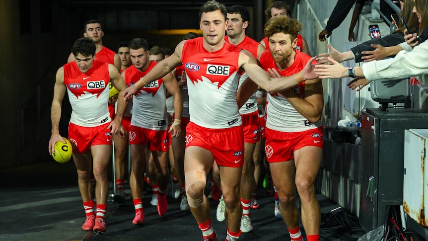 Will Hayward leads Sydney Swans out onto the ground