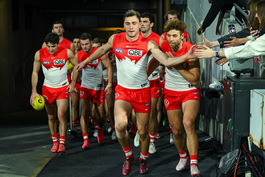 Will Hayward leads Sydney Swans out onto the ground