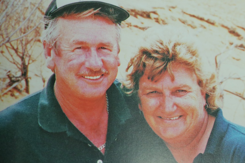 Man and woman head and shoulder smiling at the camera