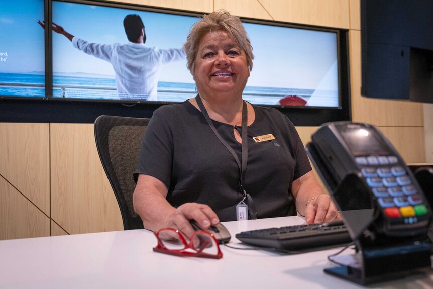 Ana Maria Cuadros sitting at the customer service desk at NAB Castle Hill.