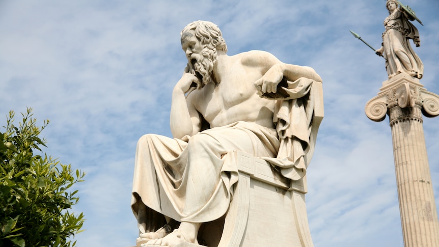 Statue of Socrates with blue sky behind