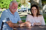 Jacqui Lambie and her dad Tom sit under a tree.