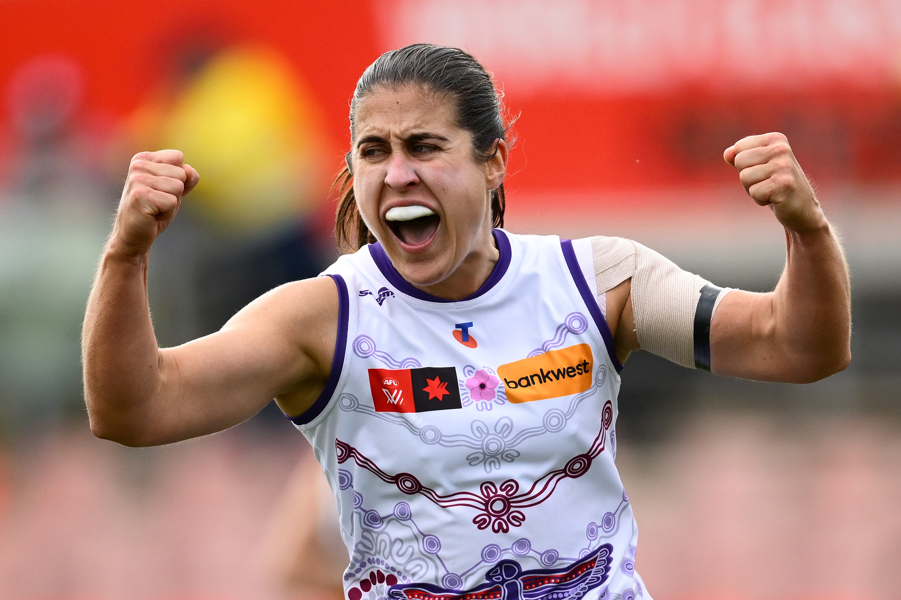 Gabby O'Sullivan pumps both fists in celebration.