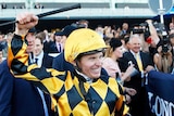 James McDonald celebrates after riding It's A Dundeel to victory in the Queen Elizabeth Stakes
