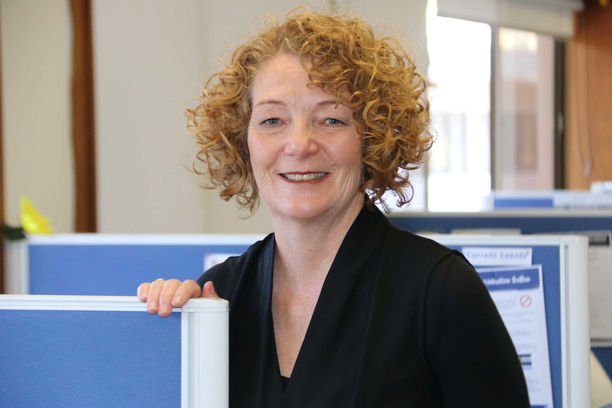 LifelineWA chief executive Lorna MacGregor stands in an office.