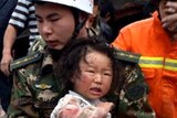 Young girl rescued from rubble