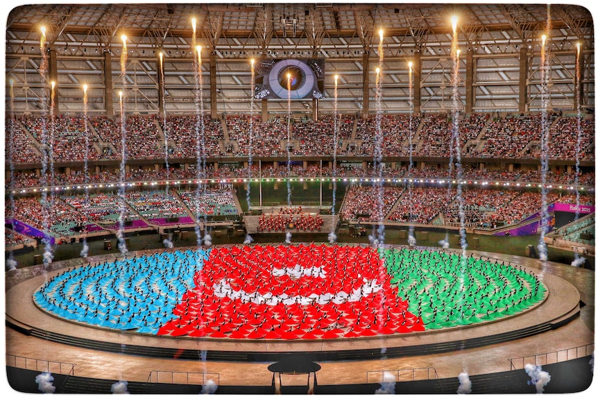 Performers depict Azerbaijan national flag at European Games opening ceremony.