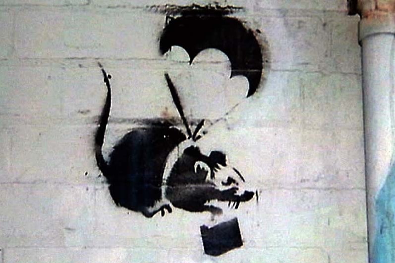 A stencil of a parachuting rat by famous street artist Banksy that was on a wall in Prahran