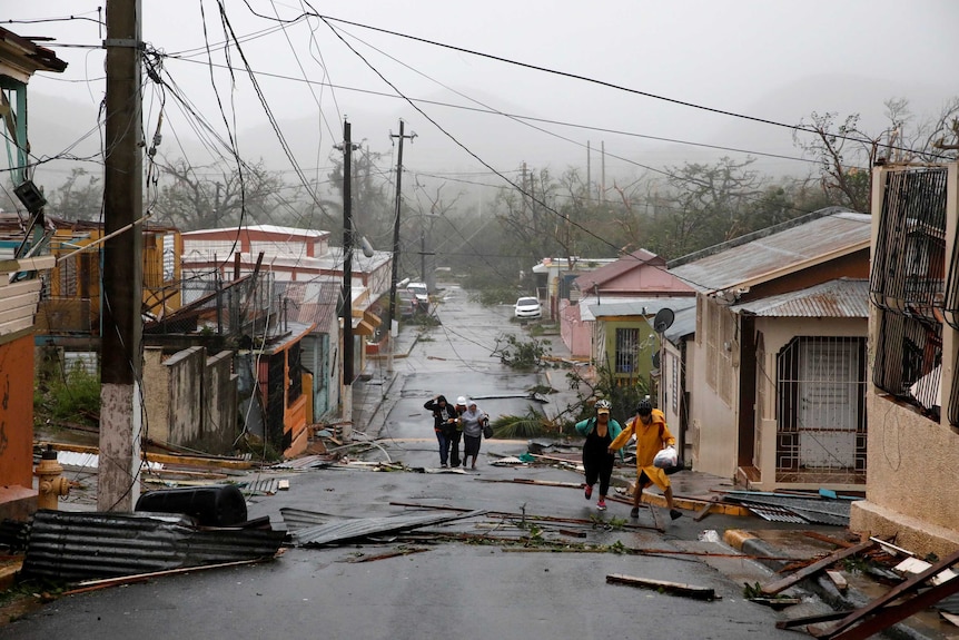 Rescue workers help people in Guayama, Puerto Rico on September 20, 2017