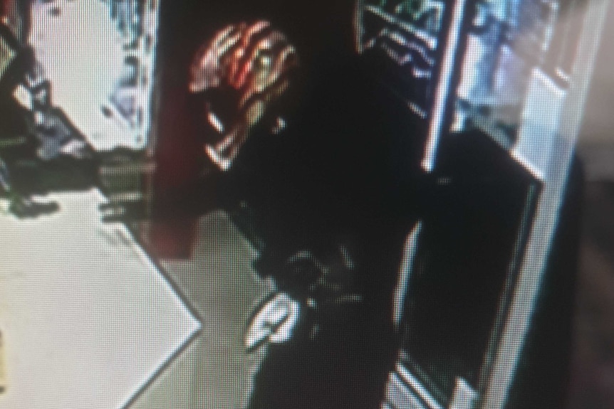 Security camera vision of an armed robber