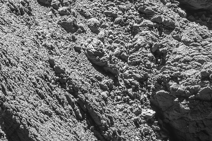 A close-up image of the surface of comet 67P, which appears rocky and uneven