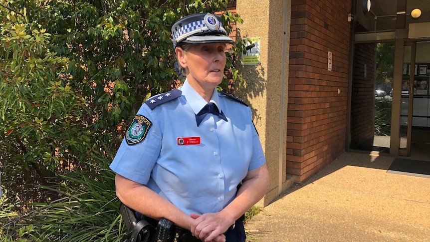 A female police officer speaking to media