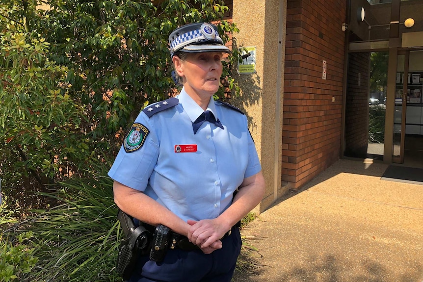 A female police officer speaking to media